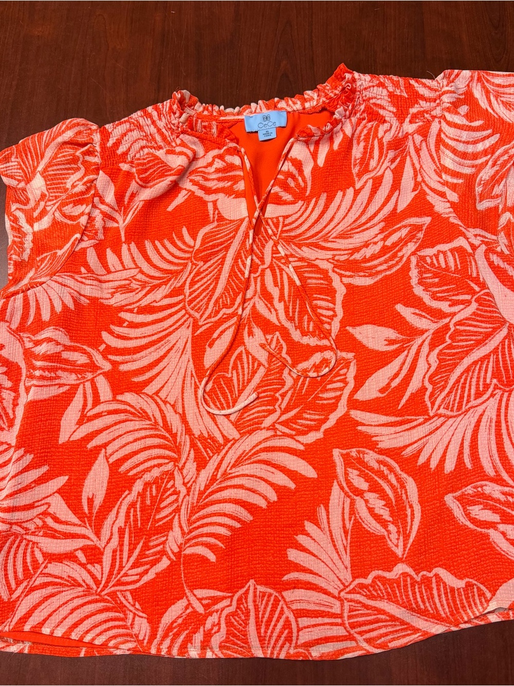 CeCe Orange and Cream Tropical Leaf Ruffle-Neck Sleeveless Top